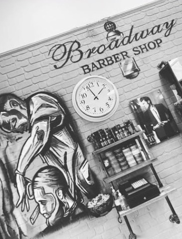 Broadway Barber Shop signage and mural on the shop wall