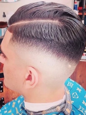 Hard part comb over with a skin fade